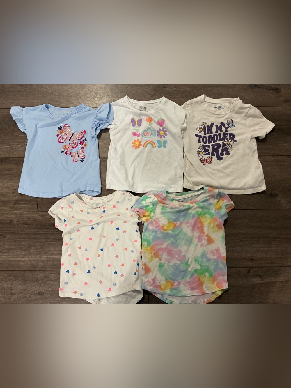 6 kids 3T girls shirts and 1 dress.